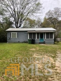 2985 Grant Road Columbus, GA 31907 - Photo 1 of 1 a front view of house with yard and trees around