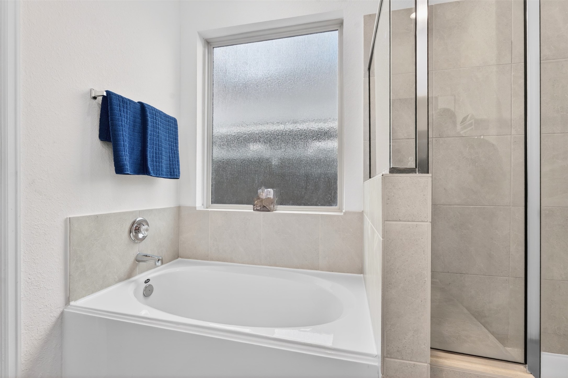 2832 Mistygate Court Conroe, TX 77301 - Photo 19 of 50 Beautiful primary bathroom featuring a relaxing soaking tub and natural light that creates a bright and inviting feel. Great for relaxing.