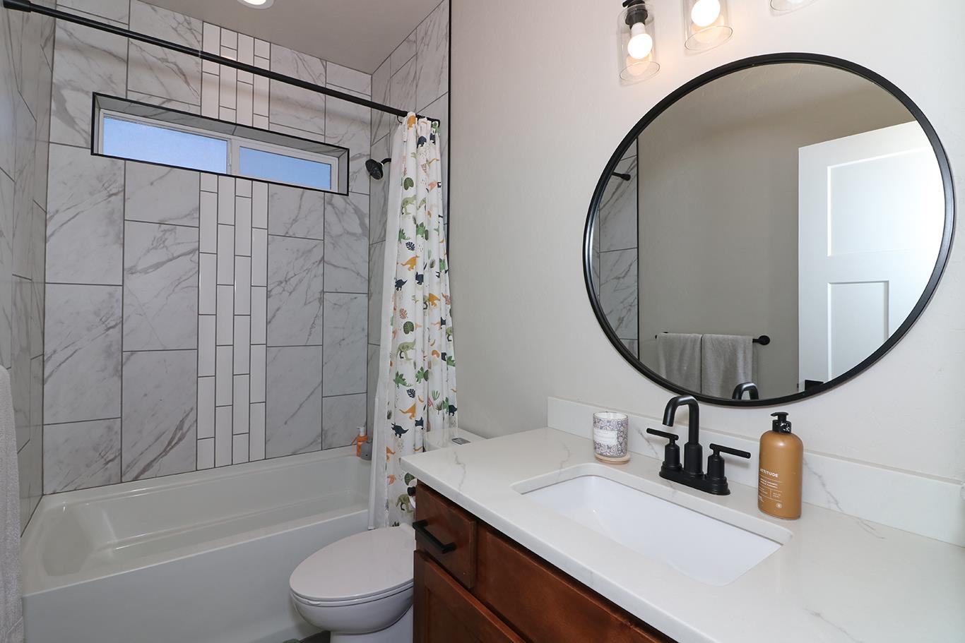 834 Adams Drive Fruita, CO 81521 - Photo 18 of 42 a bathroom with a sink a toilet and a mirror