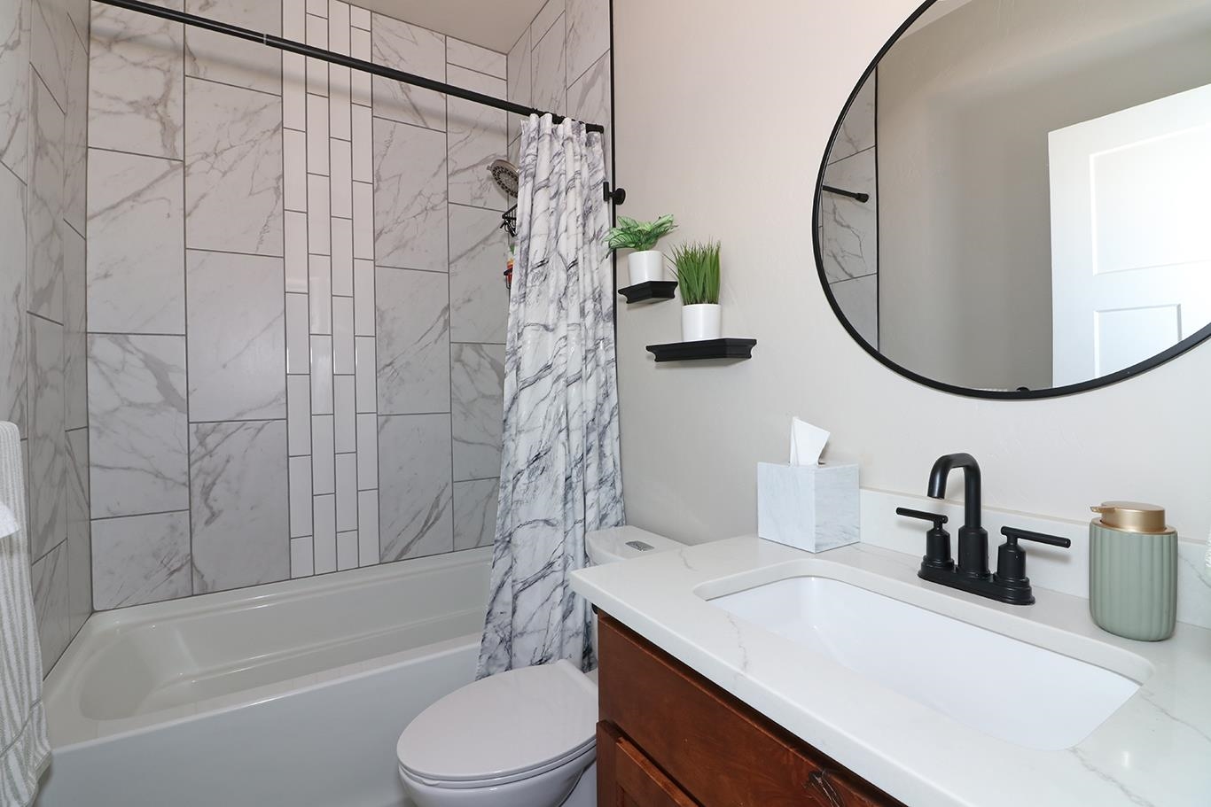 834 Adams Drive Fruita, CO 81521 - Photo 35 of 42 a bathroom with a sink a toilet and a mirror