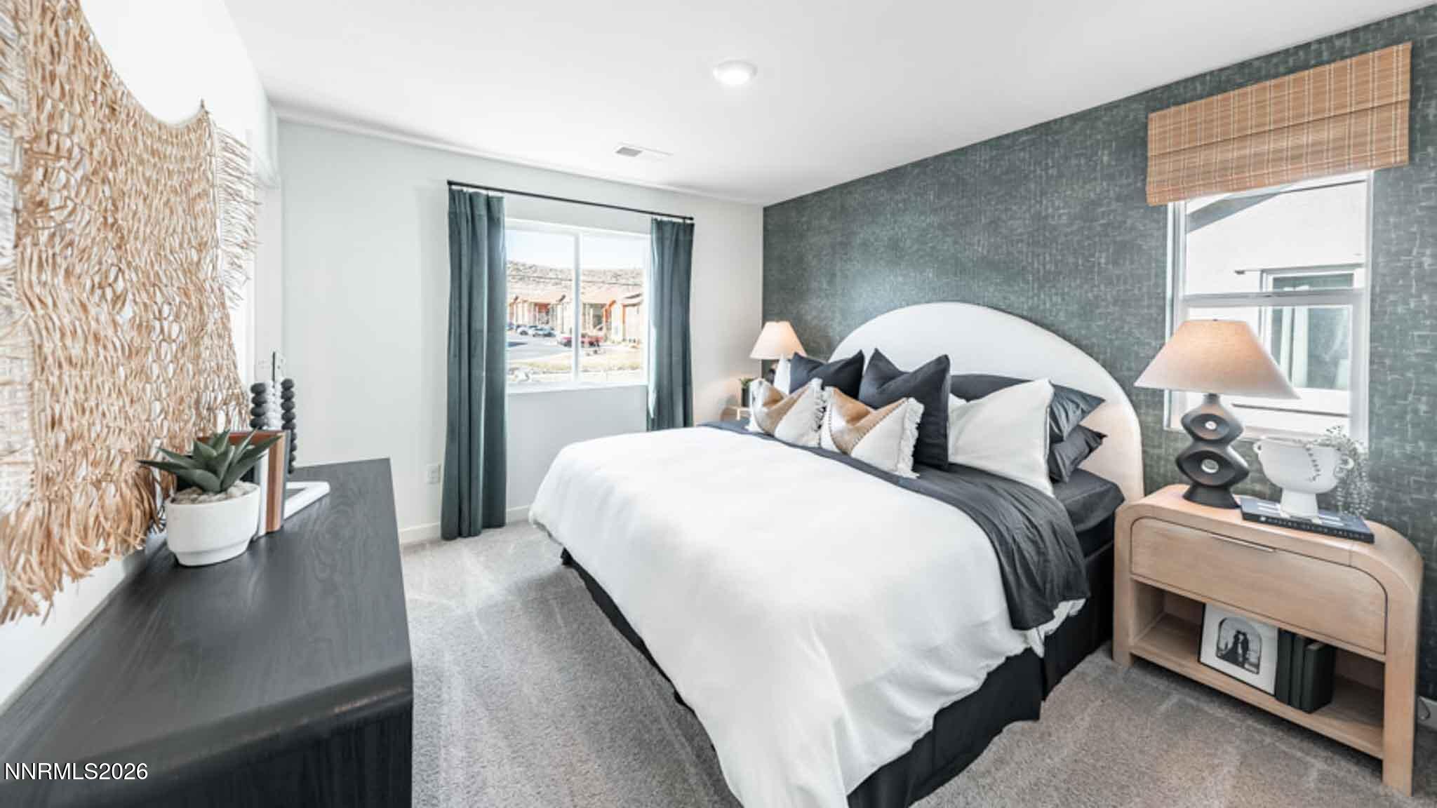 8387 Vermilion Drive Reno, NV 89506 - Photo 10 of 16 a bedroom with a bed and a potted plant