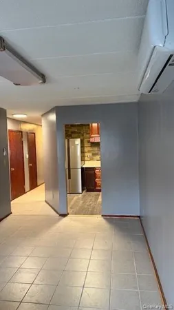a view of an empty room and fire place