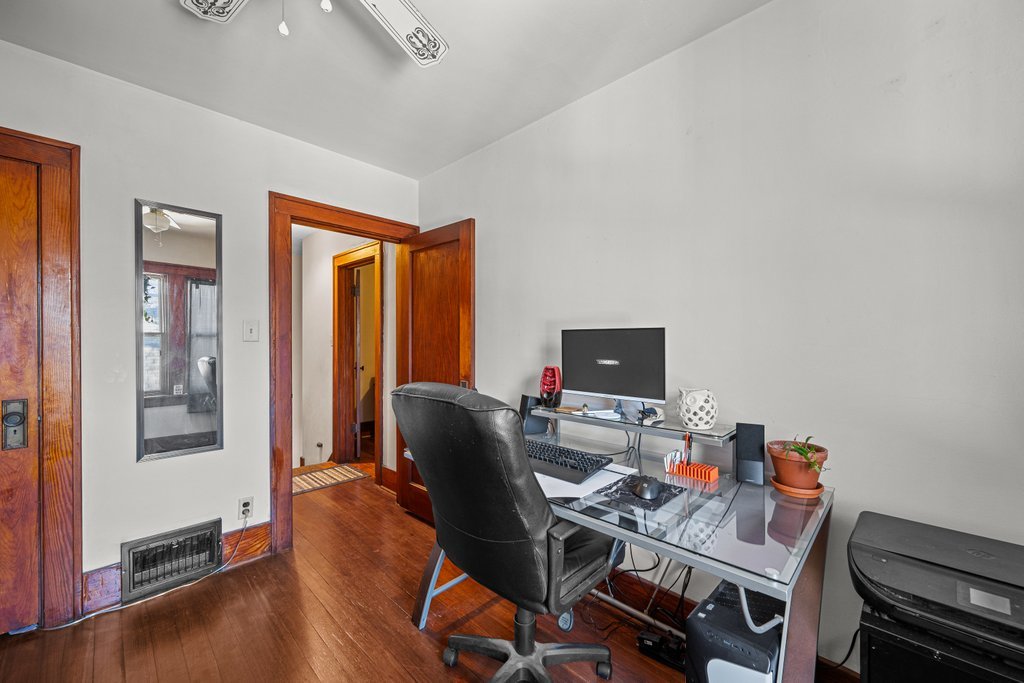 4202 10th Avenue Moline, IL 61265 - Photo 11 of 18 a workspace with furniture and wooden floor