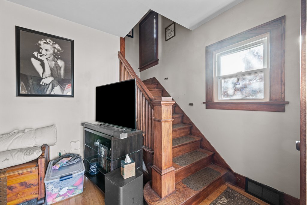 4202 10th Avenue Moline, IL 61265 - Photo 2 of 18 a living room with furniture and a flat screen tv