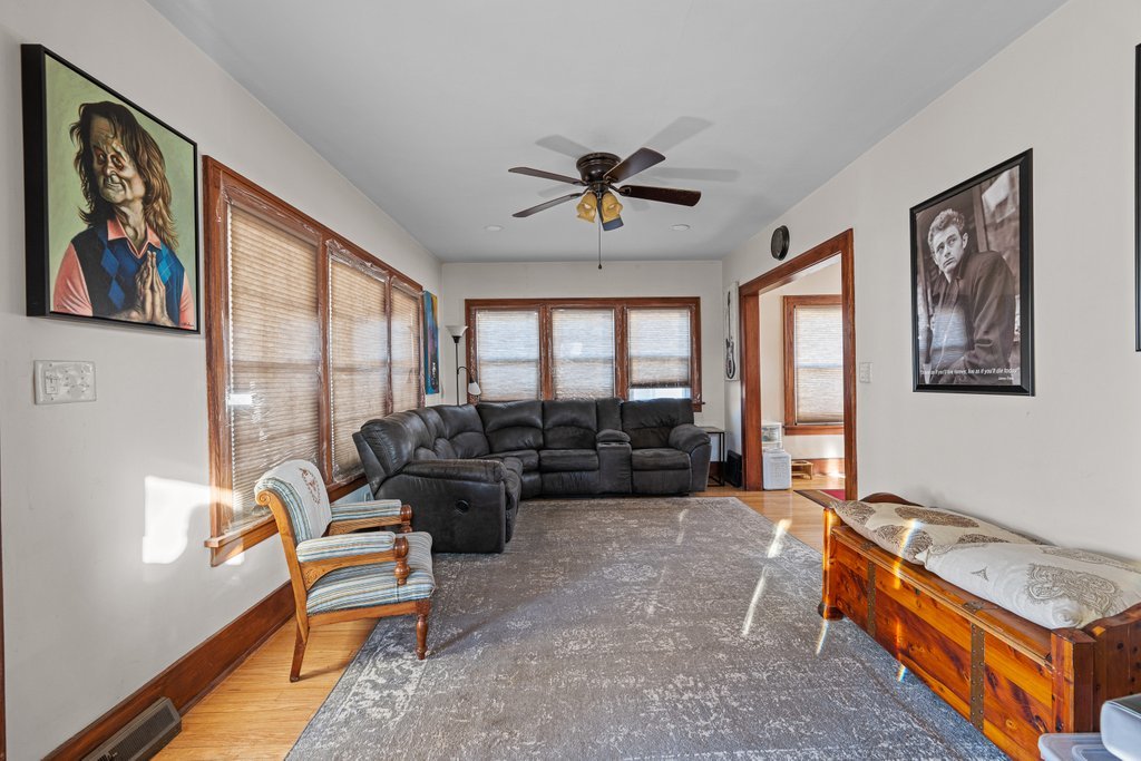 4202 10th Avenue Moline, IL 61265 - Photo 3 of 18 a living room with furniture gym equipment and a large window