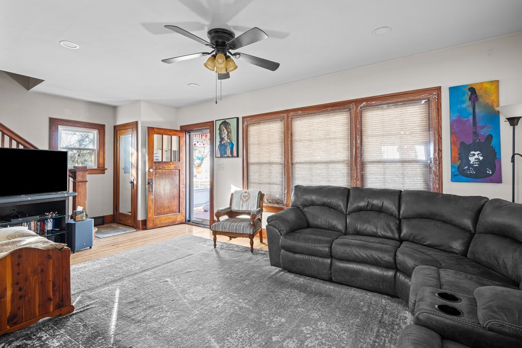 4202 10th Avenue Moline, IL 61265 - Photo 4 of 18 a living room with furniture and a flat screen tv