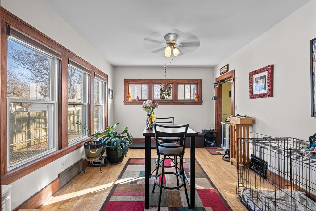 4202 10th Avenue Moline, IL 61265 - Photo 5 of 18 a living room with furniture a wooden floor and a window