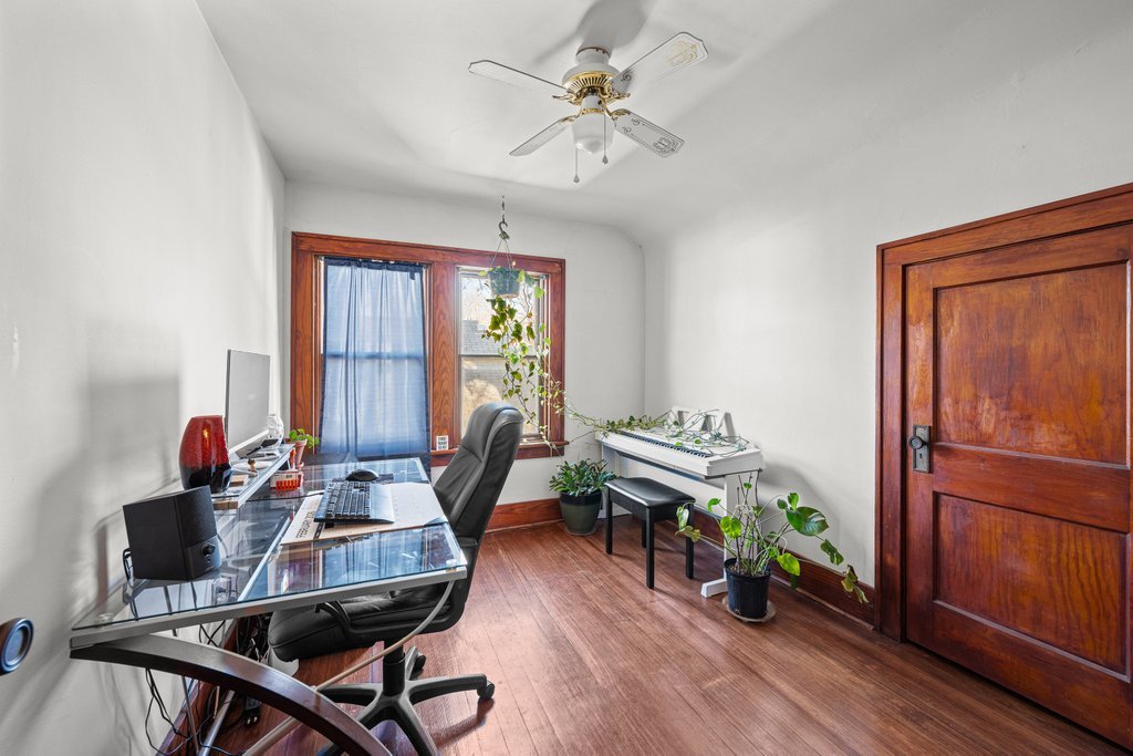 4202 10th Avenue Moline, IL 61265 - Photo 10 of 18 a work room with furniture and wooden floor
