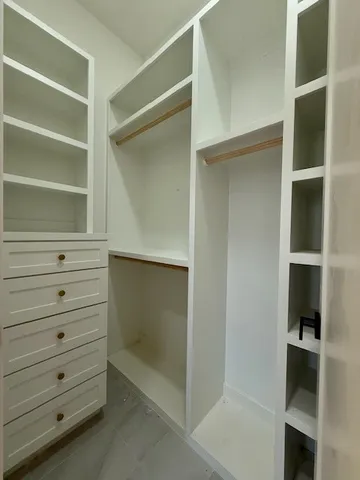 a close up view of a walk in closet