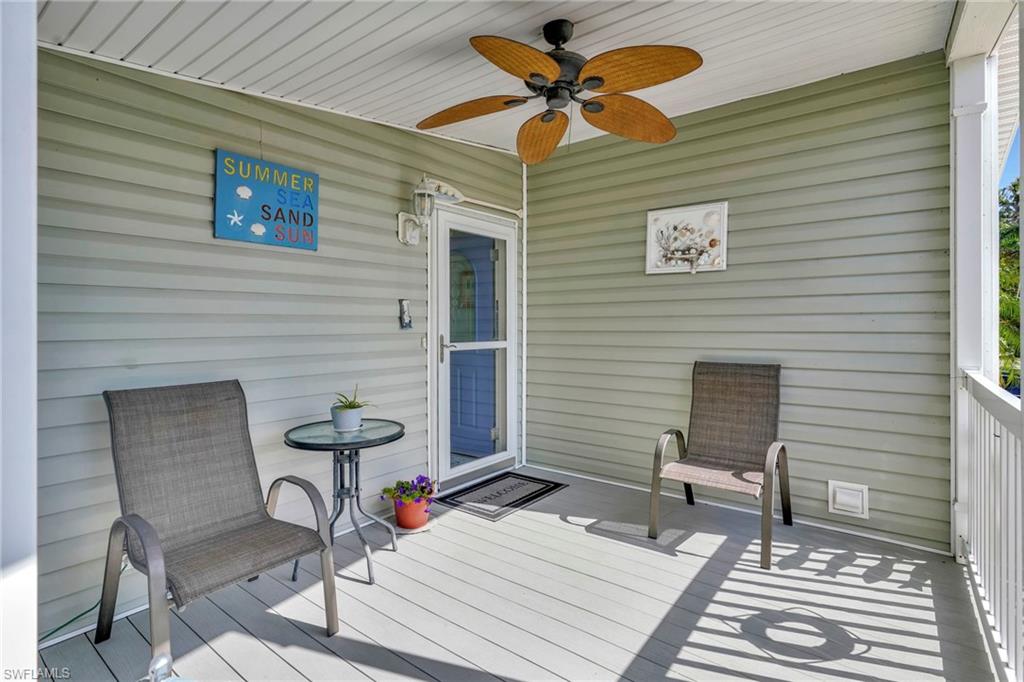 10709 Roseate Spoonbill Circle Estero, FL 33928 - Photo 19 of 32 a balcony view with a sitting space and a rug