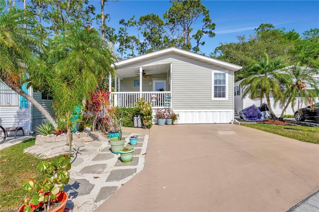 10709 Roseate Spoonbill Circle Estero, FL 33928 - Photo 2 of 32 a view of a house with backyard and sitting area
