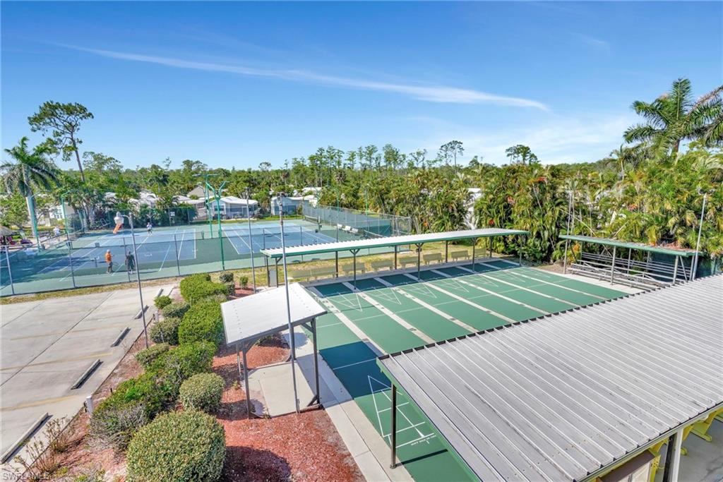 10709 Roseate Spoonbill Circle Estero, FL 33928 - Photo 28 of 32 a view of a chairs and table on the terrace