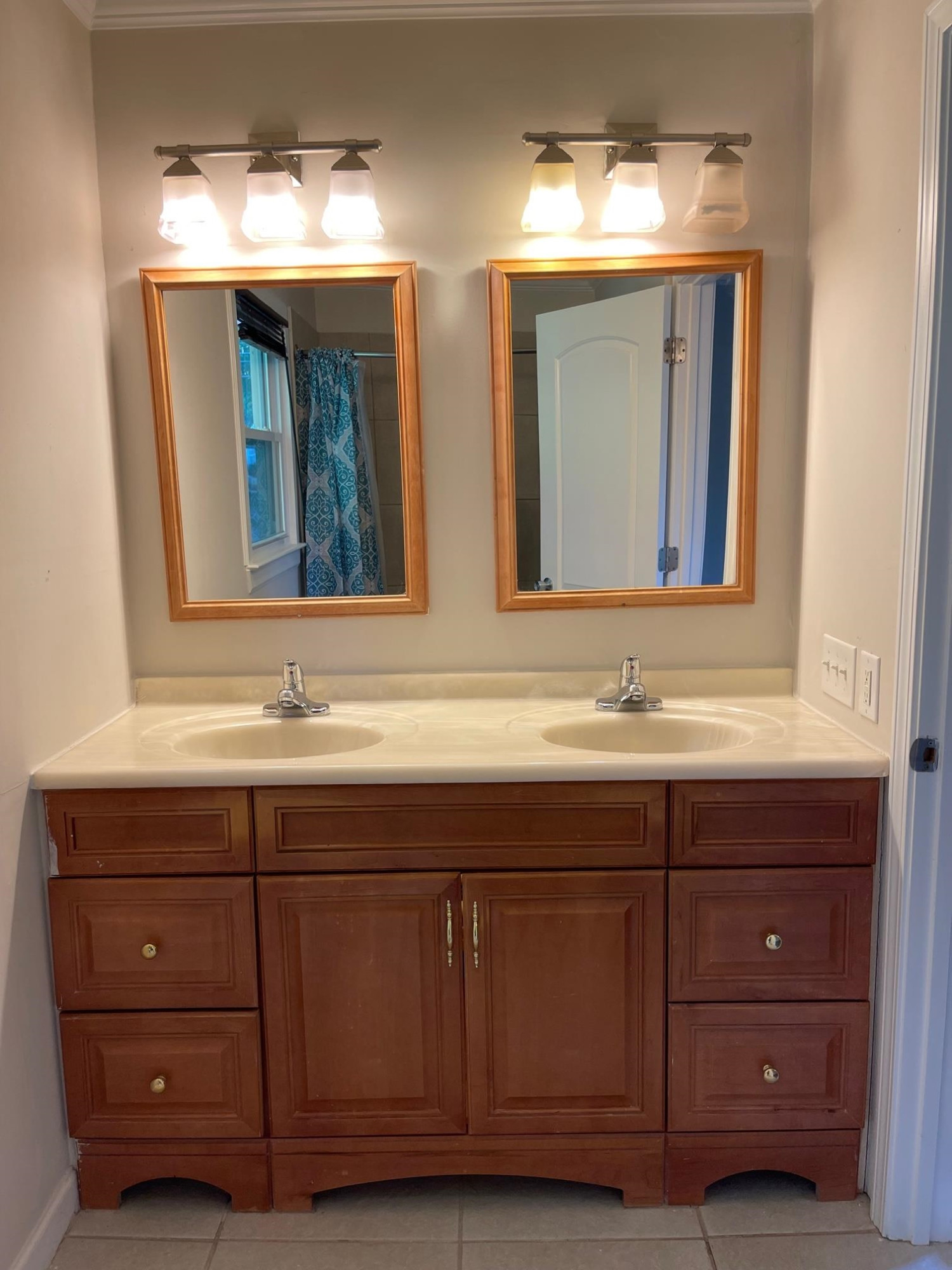 606 Infinity Road Durham, NC 27712 - Photo 13 of 30 a bathroom with a double vanity sink and a mirror