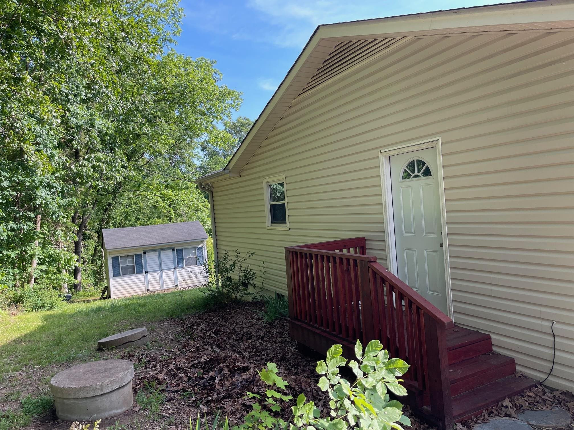 606 Infinity Road Durham, NC 27712 - Photo 17 of 30 a front view of a house with garden