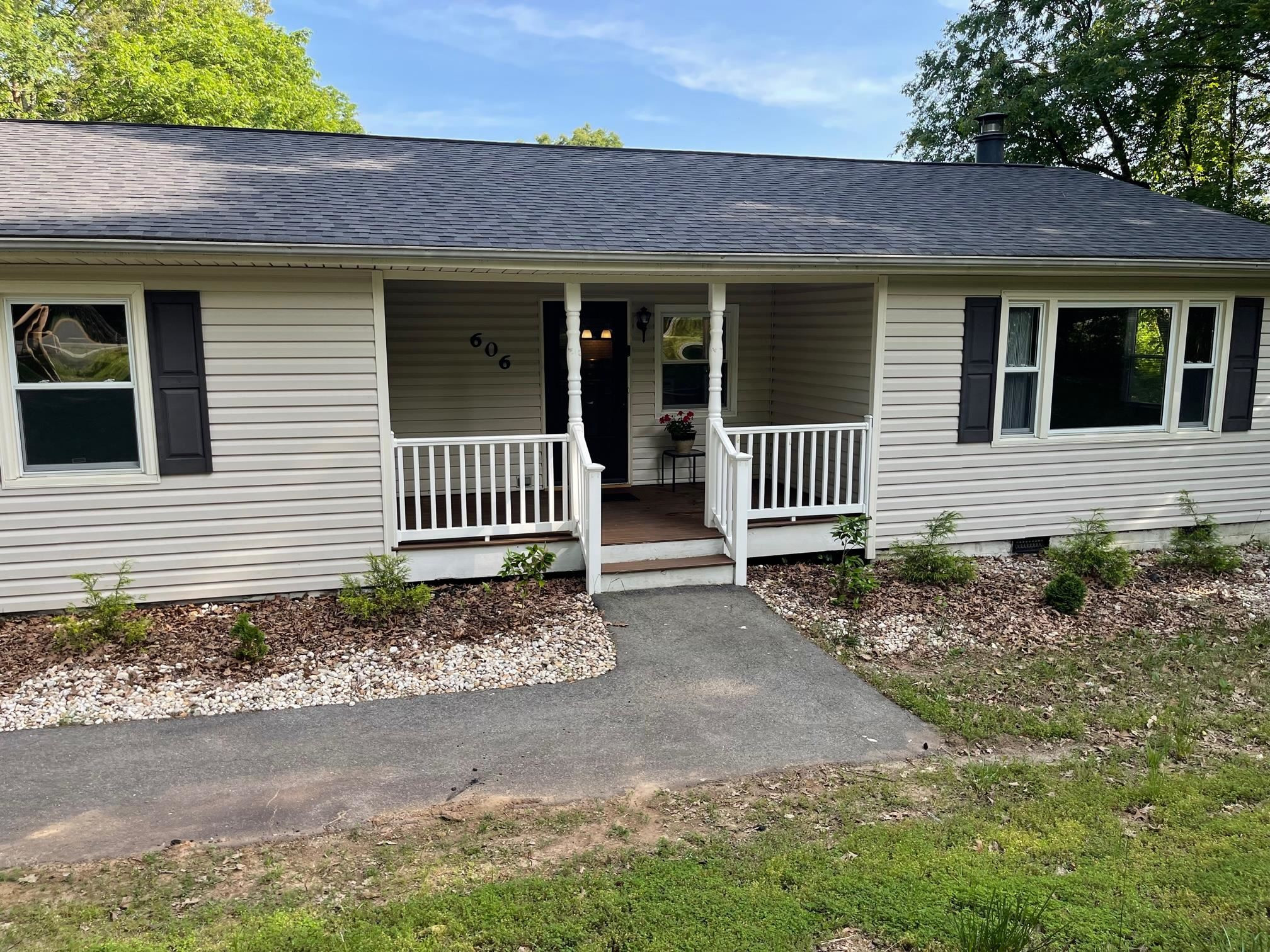 606 Infinity Road Durham, NC 27712 - Photo 2 of 30 a front view of a house with garden