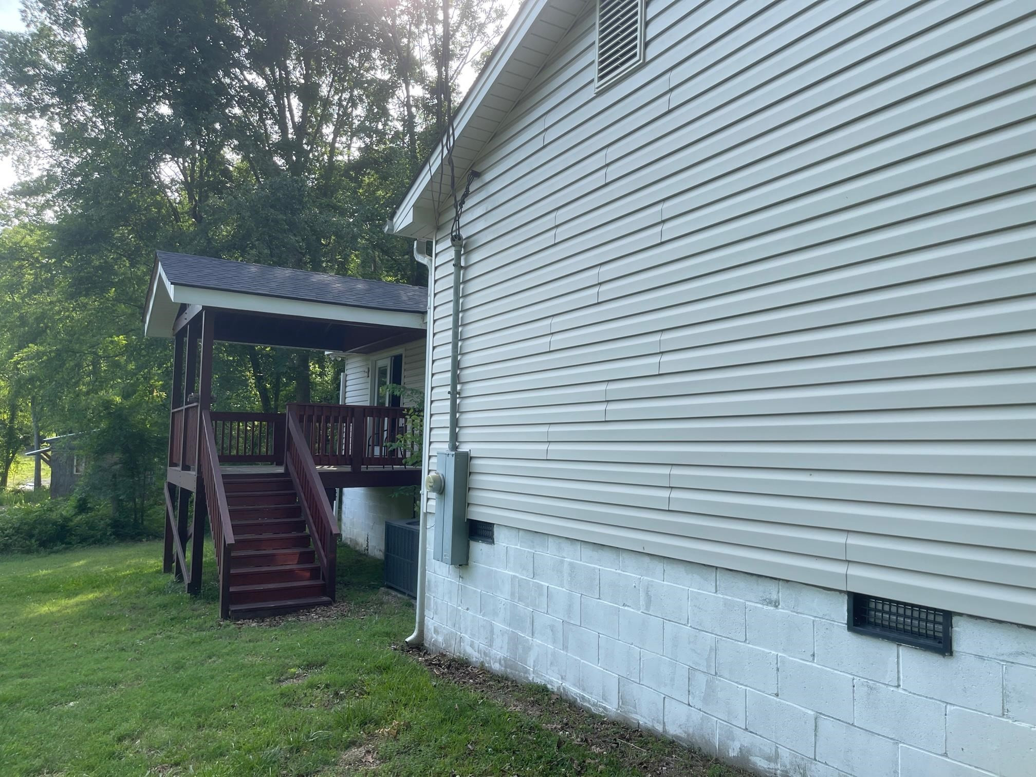 606 Infinity Road Durham, NC 27712 - Photo 28 of 30 a view of a chair in backyard of the house