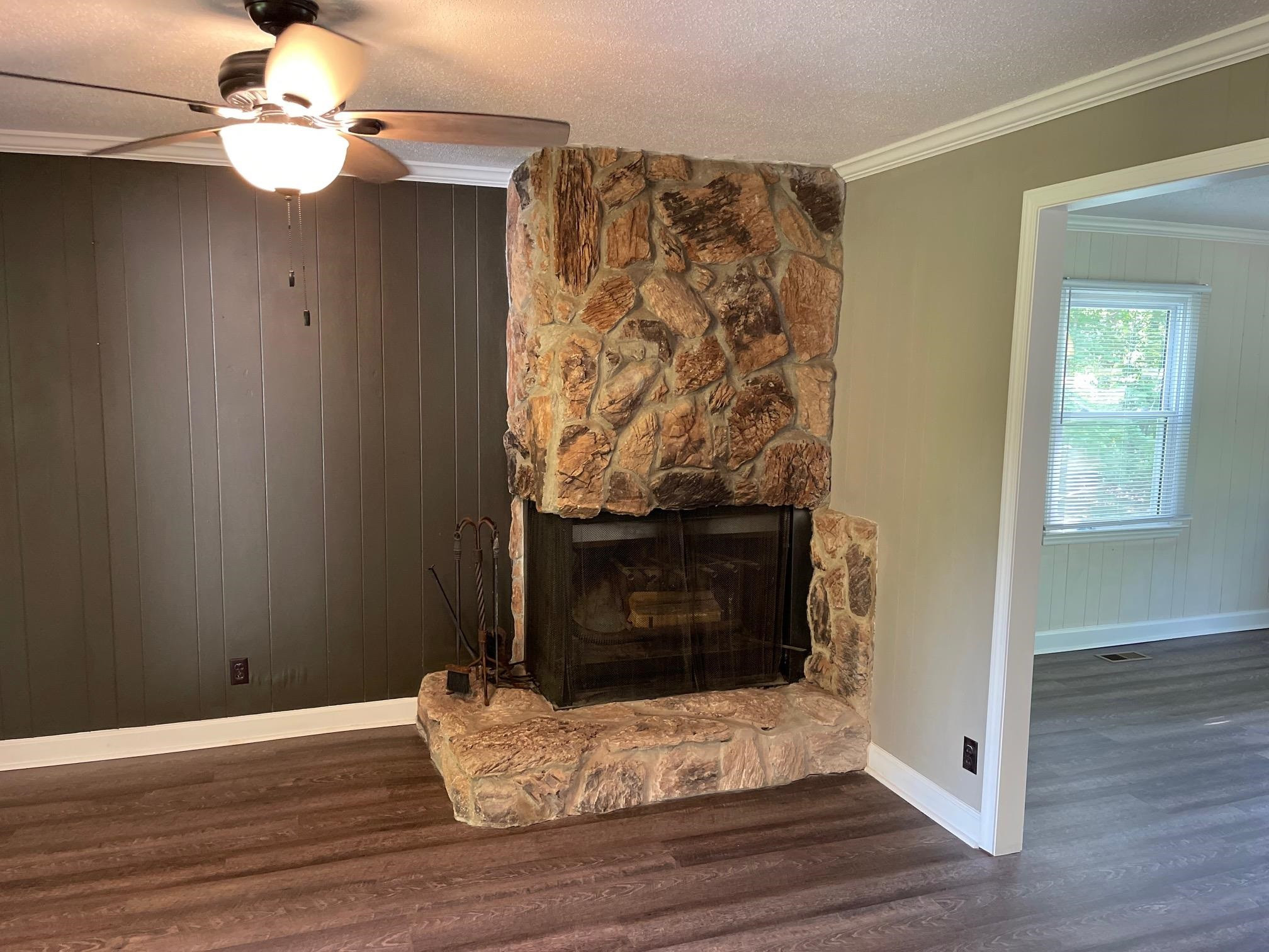 606 Infinity Road Durham, NC 27712 - Photo 10 of 30 a view of fireplace with wooden floor