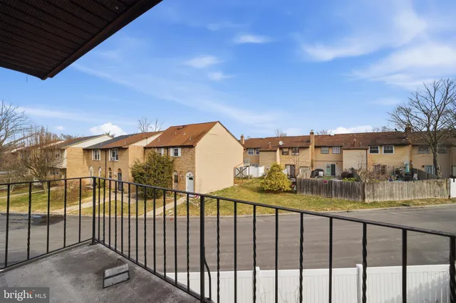 a hallway with a washer and dryer