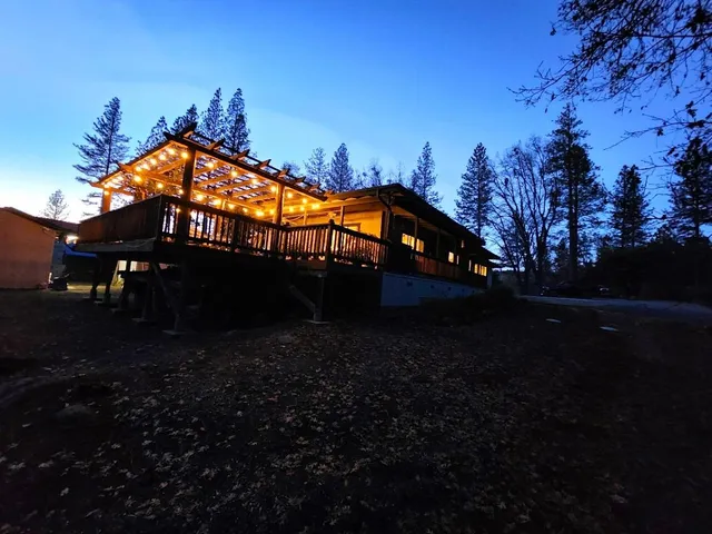 a view of a deck with wooden floor and outdoor seating
