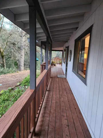 a view of backyard with cabin