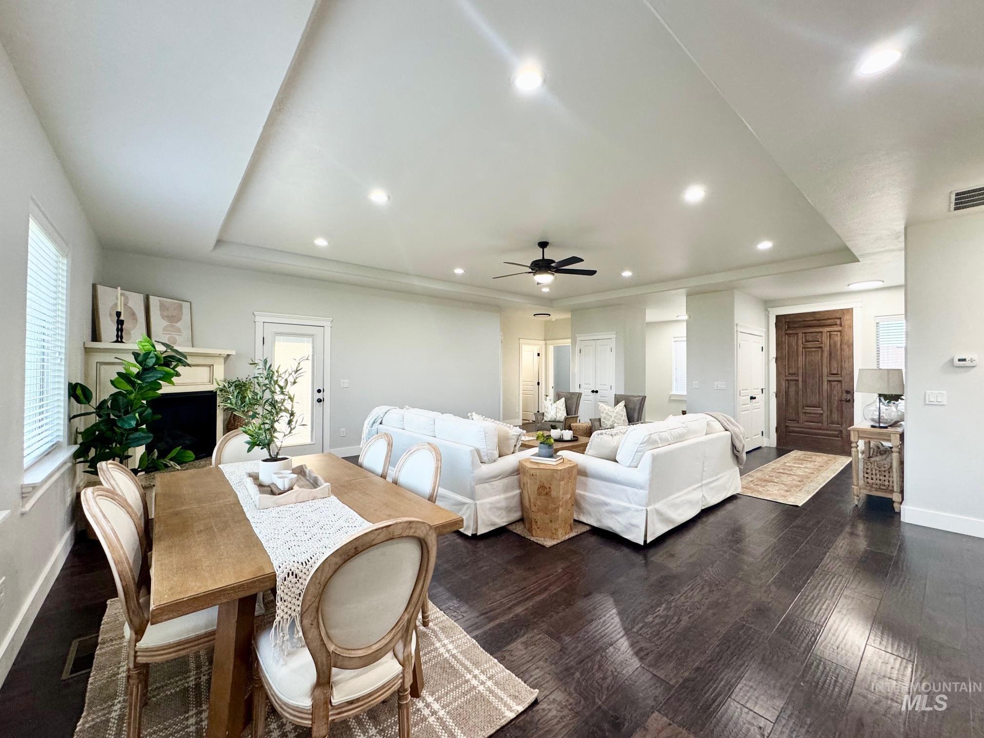 650 Lochsa Loop Heyburn, ID 83336 - Photo 11 of 26 Dining area with recessed lighting, dark wood-style flooring, a raised ceiling, and ceiling fan