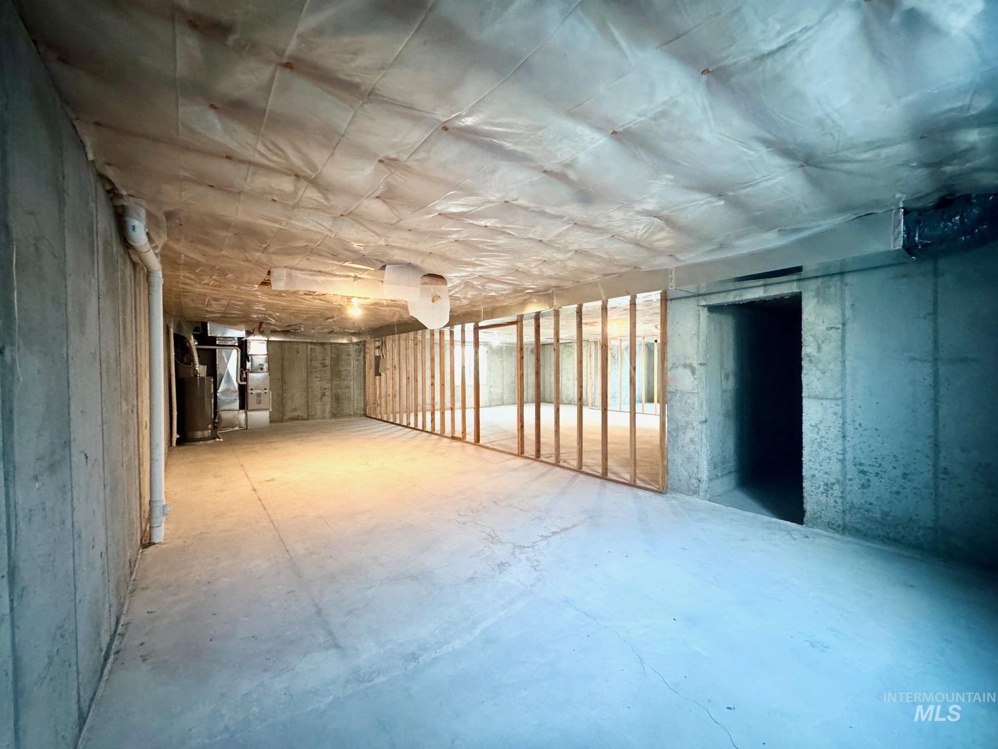 650 Lochsa Loop Heyburn, ID 83336 - Photo 23 of 26 Unfinished below grade area featuring water heater and heating unit