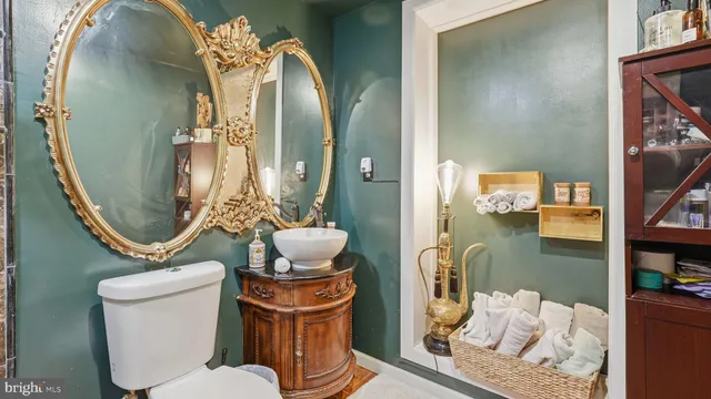 a view of kitchen with granite countertop cabinets and window