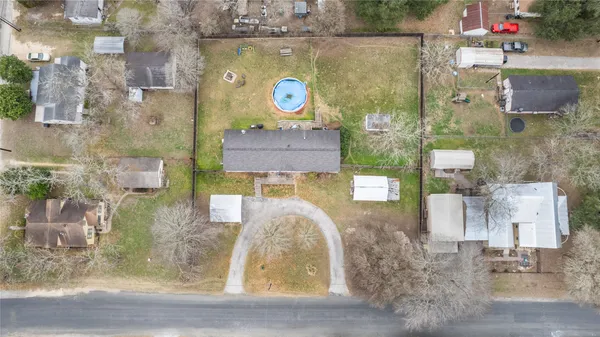 a house view with a play ground in front of it