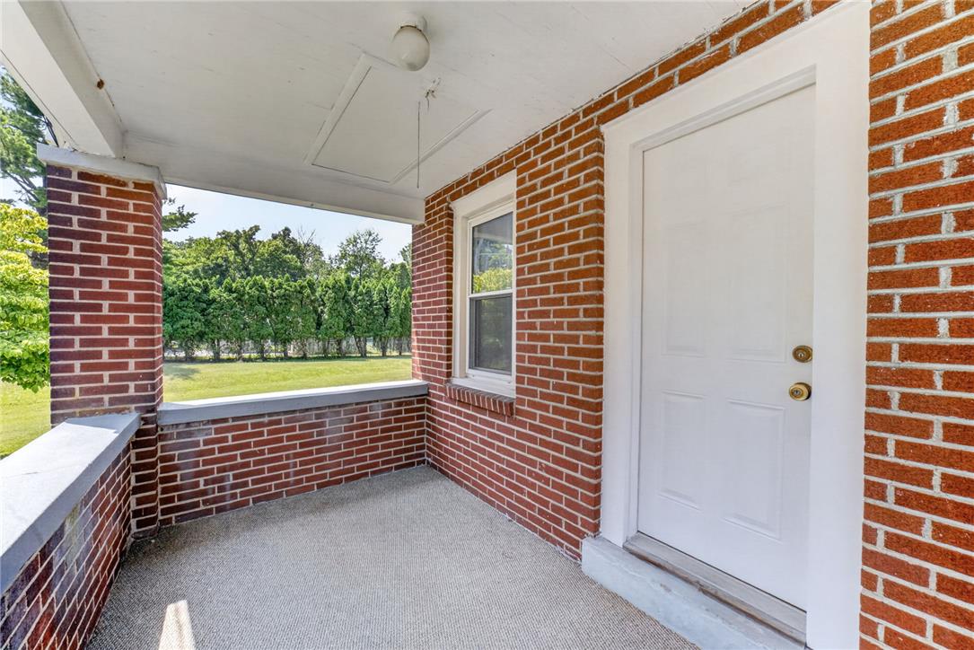 1166 Stones Crossing Road Easton, PA 18045 - Photo 3 of 35 A welcoming front porch features sturdy brickwork and offers tranquil views of a manicured lawn and privacy plantings.