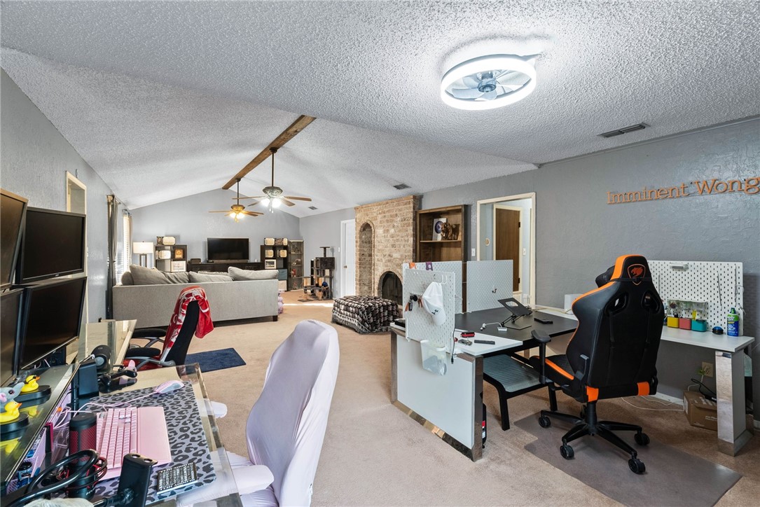 4114 Beard Drive Corpus Christi, TX 78413 - Photo 14 of 40 a workspace with furniture gym equipment and a flat screen tv