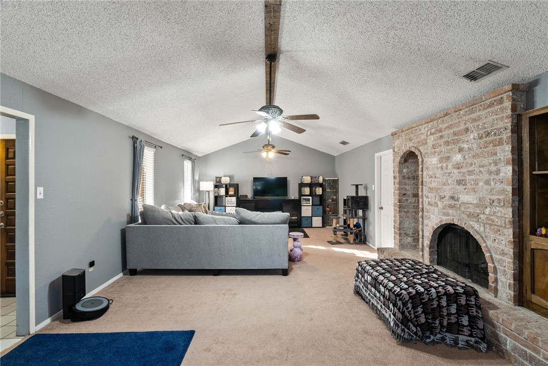 4114 Beard Drive Corpus Christi, TX 78413 - Photo 16 of 40 a living room with furniture and a fireplace