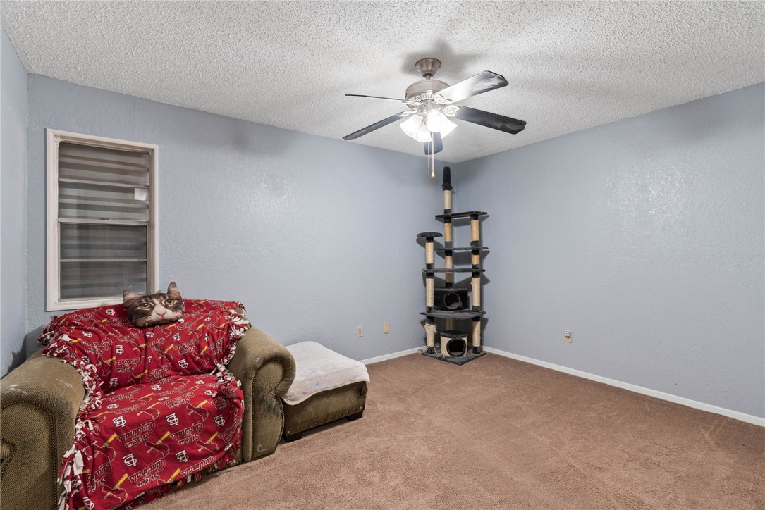 4114 Beard Drive Corpus Christi, TX 78413 - Photo 24 of 40 a bedroom with a bed and a chandelier
