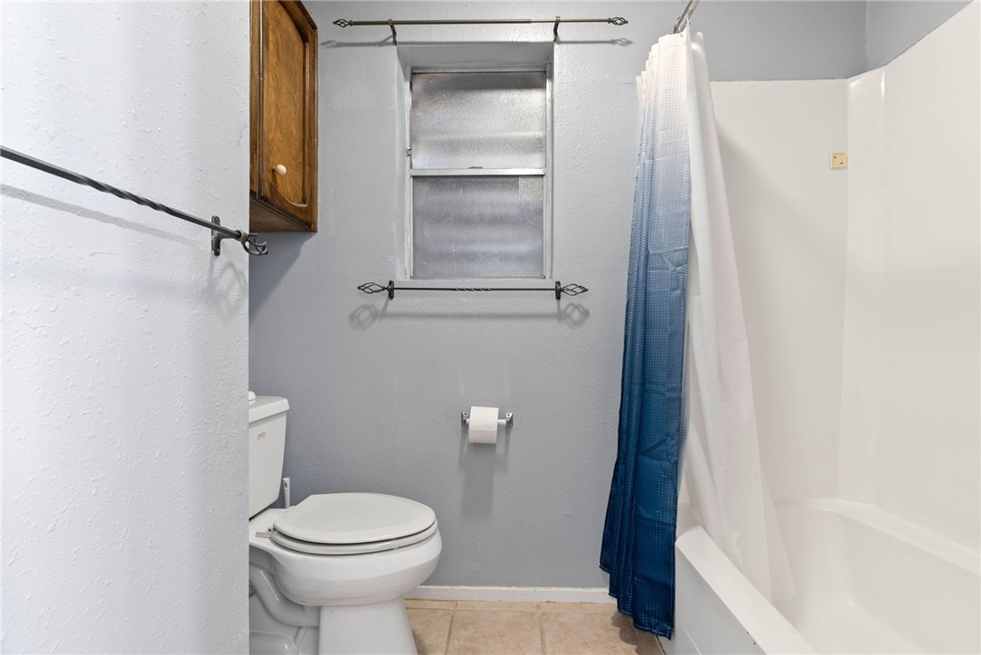 4114 Beard Drive Corpus Christi, TX 78413 - Photo 28 of 40 a bathroom with a toilet and a shower