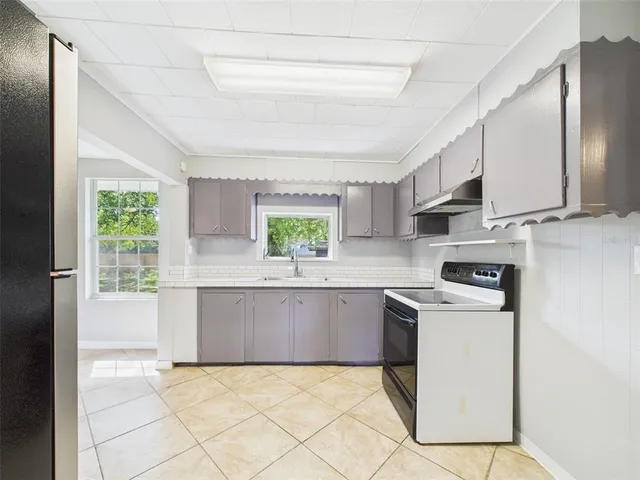 a view of a house with a yard and plants