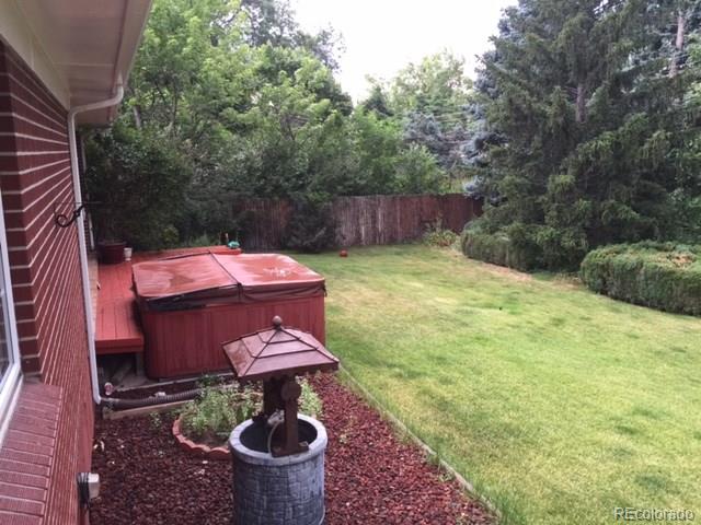 529 West Ridge Road Littleton, CO 80120 - Photo 4 of 21 a backyard of a house with yard and outdoor seating