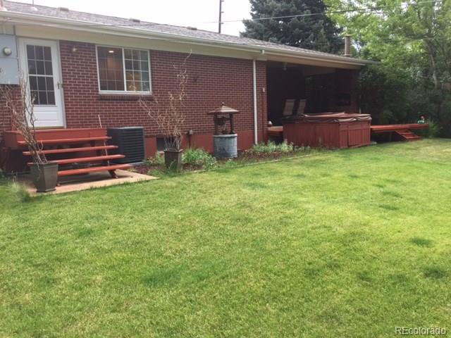 529 West Ridge Road Littleton, CO 80120 - Photo 8 of 21 a backyard of a house with barbeque oven and outdoor seating