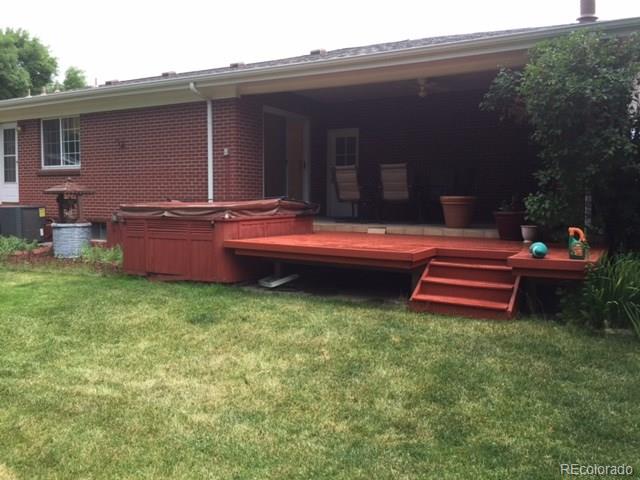 529 West Ridge Road Littleton, CO 80120 - Photo 9 of 21 a backyard of a house with wooden floor and outdoor seating