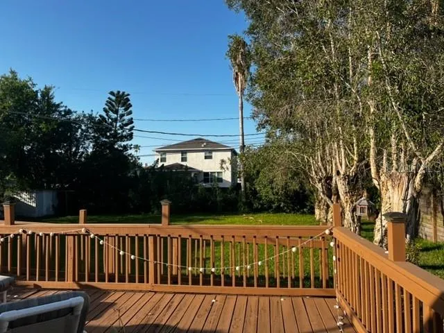 a view of table and chairs under an umbrella