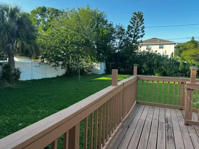 a view of a chairs and table on the deck