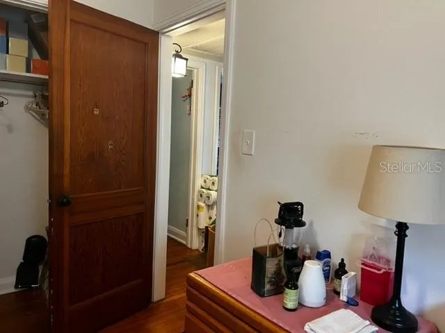 a living room with furniture and a mirror