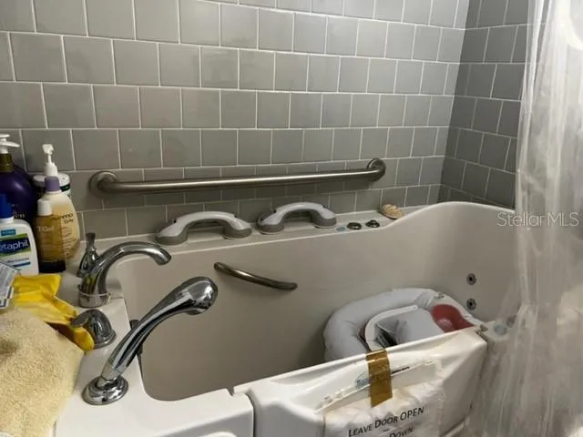 a view of balcony with wooden floor and fence