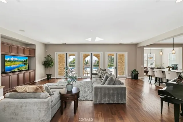 a kitchen with stainless steel appliances granite countertop a sink and a refrigerator