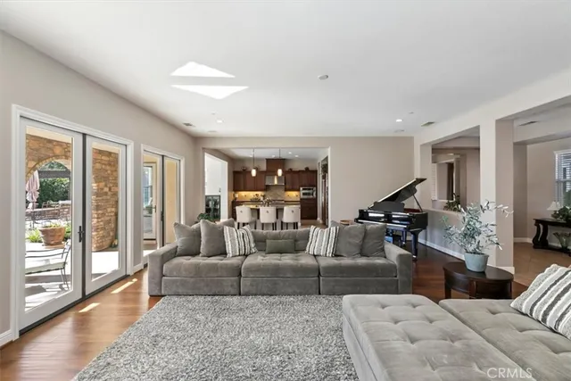 a large kitchen with granite countertop a sink and a large window