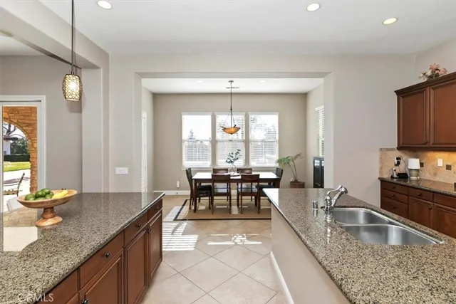 a bedroom with a large bed couch and a window