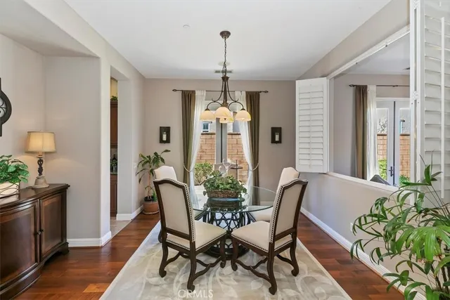 a bathroom with a granite countertop shower a mirror and a sink