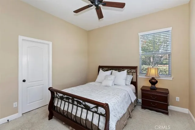 a view of a house with pool and chairs