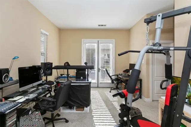 a view of a chairs and table in patio with a lake view