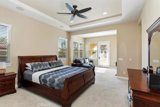 a view of a house with swimming pool and sitting area