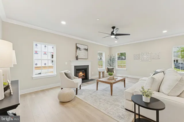 a living room with furniture and a chair