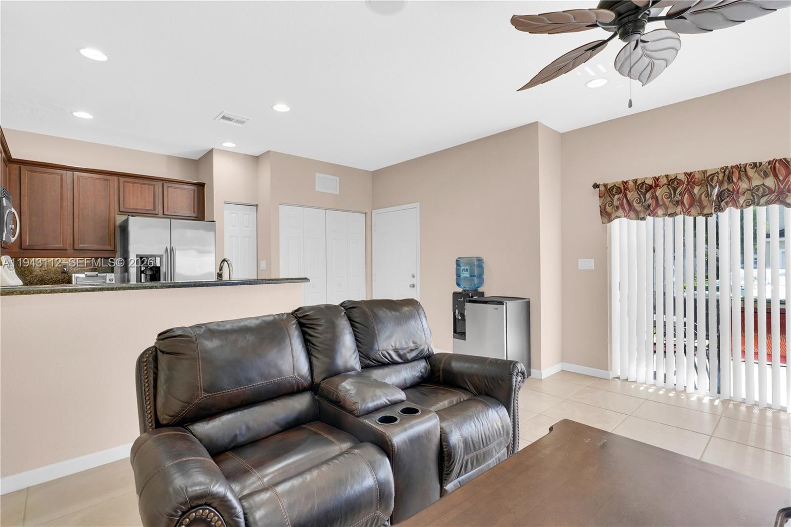 14102 Southwest 276th Street Homestead, FL 33032 - Photo 12 of 36 a living room with furniture and a ceiling fan